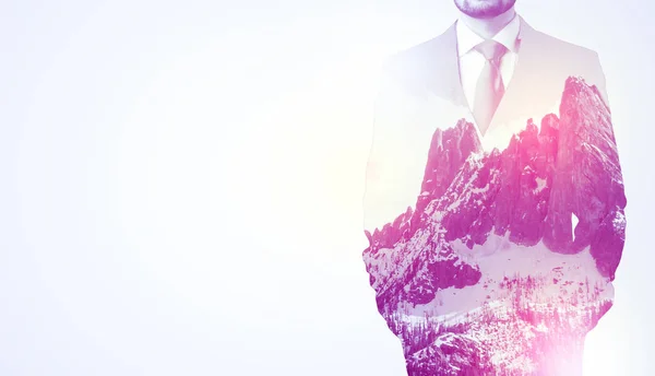 Businessman standing with mountain graphic — Stock Photo, Image