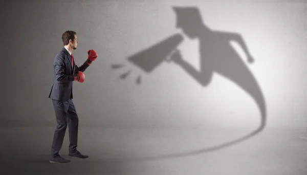 Businessman fighting with his bossy shadow — Stock Photo, Image