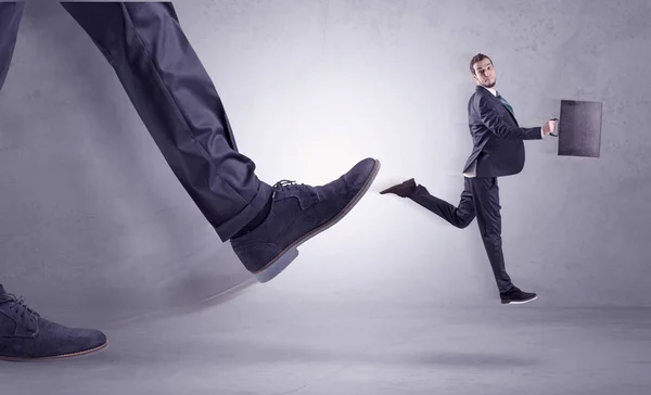 Foot kicking, businessman flying — Stock Photo, Image