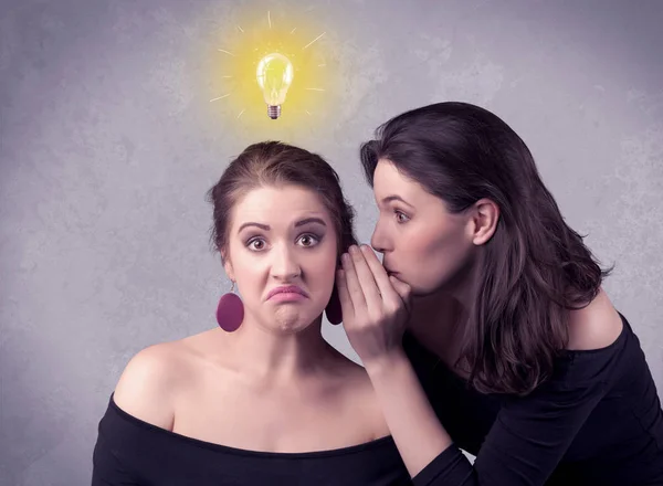 Girl telling secret things to her girlfriend — Stock Photo, Image