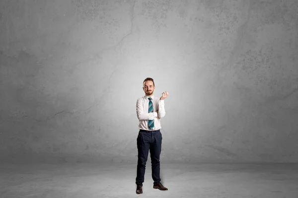 Alone businessman standing in a dark room — Stock Photo, Image