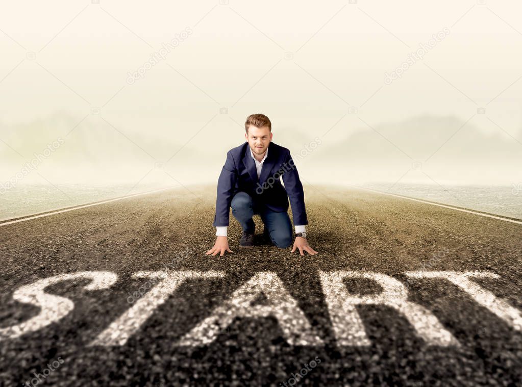 Businessman at start line