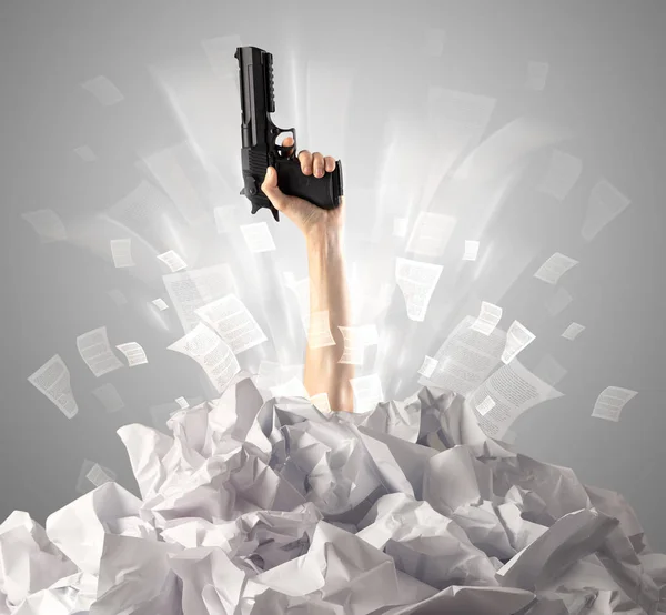 Hand coming out from paper pile — Stock Photo, Image