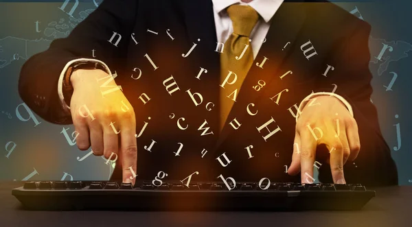 Man typing in formal clothing and letters around — Stock Photo, Image