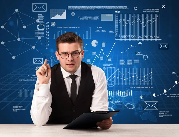 Businessman sitting at a desk — Stock Photo, Image