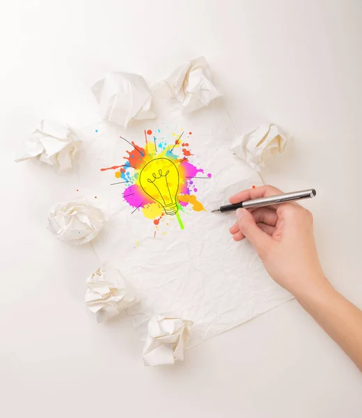 Writing hand in crumpled paper — Stock Photo, Image