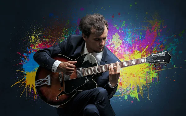 Composer with splotch and his guitar — Stock Photo, Image