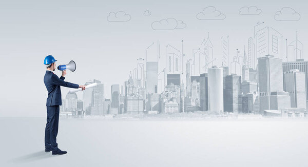 Architect standing and  replanning a city panorama