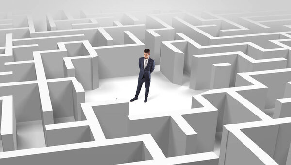 Businessman standing in a middle of a maze