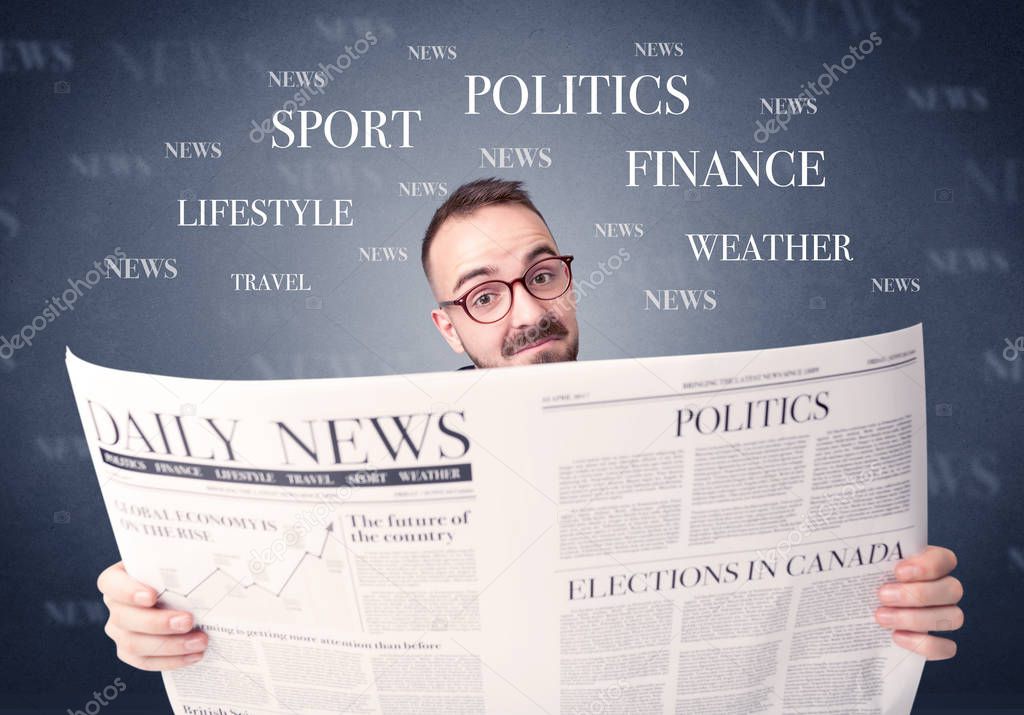 Businessman reading newspaper