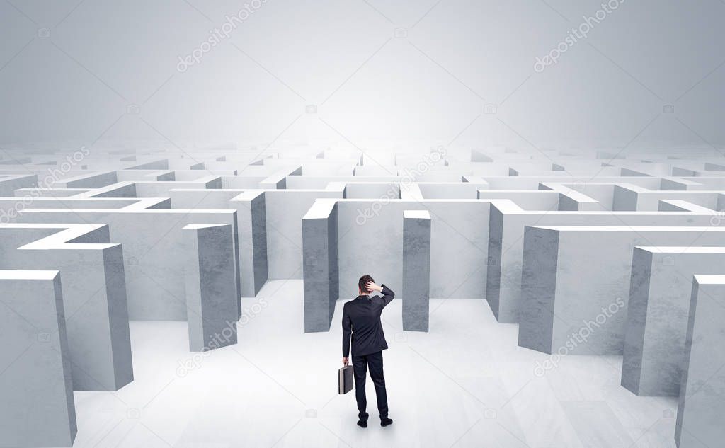 Businessman can not decide which entrance he chose outside of the maze