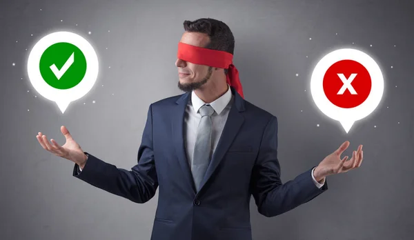 Blindfolded businessman trying to choose — Stock Photo, Image