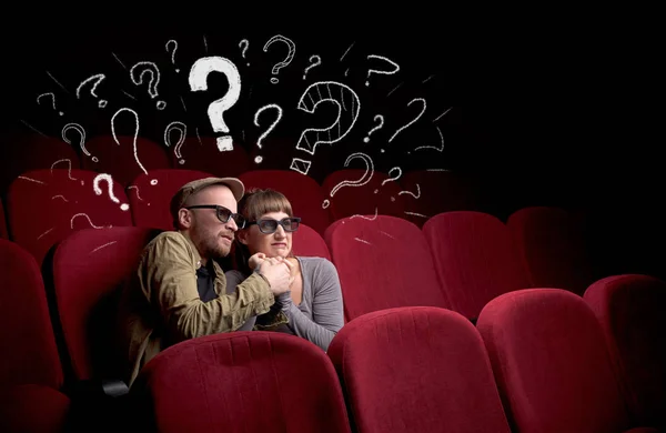 Couple in cinema with questions