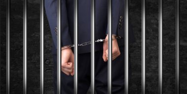 Close handcuffed man in jail clipart