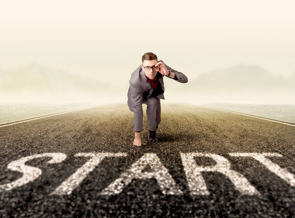 Businessman at start line