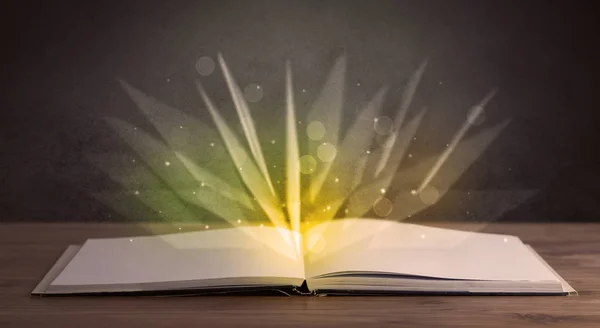 Yellow lights over book — Stock Photo, Image