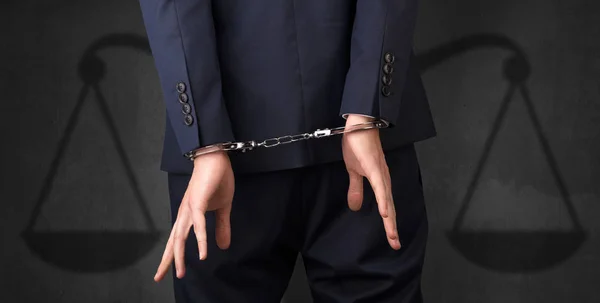 Arrested man with balance on the background — Stock Photo, Image