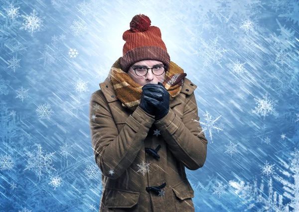 Boy freezing in warm clothing and snowing concept — Stock Photo, Image