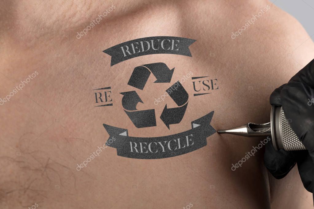 Hand tattooing recycle for a better environment concept on naked clear skin