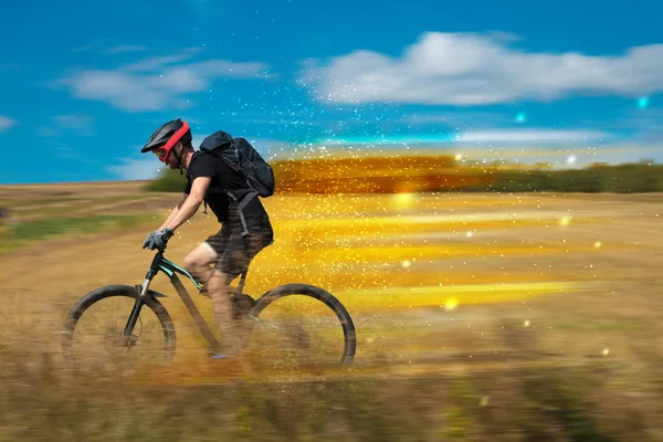 Young riding bicycle in nature — Stock Photo, Image