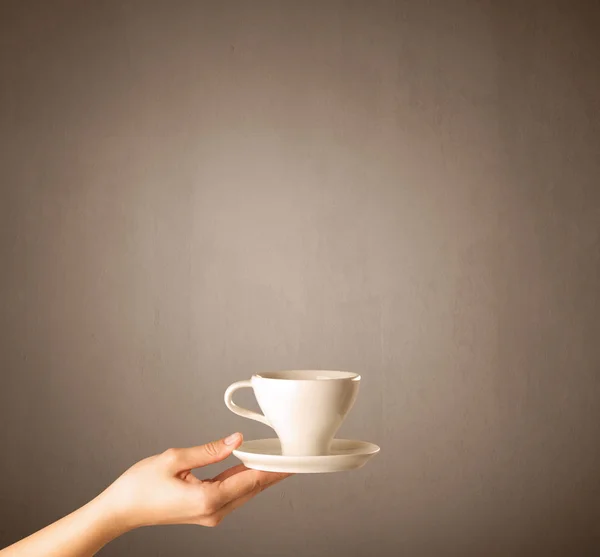 Female hand holding coffee cup — Stock Photo, Image