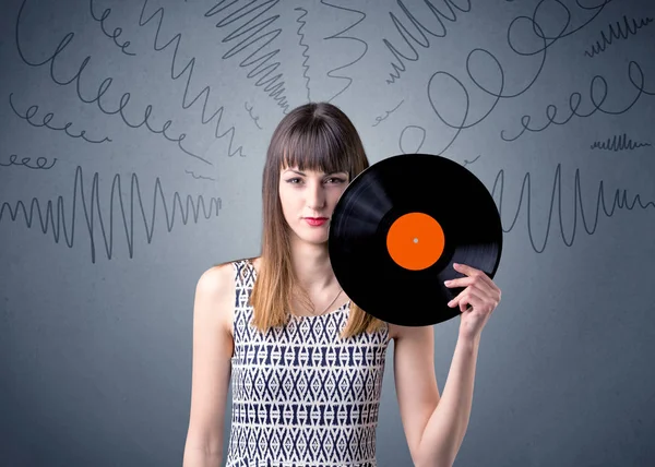 Lady vinyl record te houden — Stockfoto