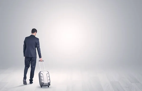 Business with luggage in a boundless space — Stock Photo, Image