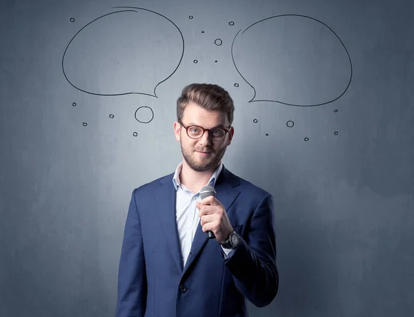 Businessman holding microphone — Stock Photo, Image