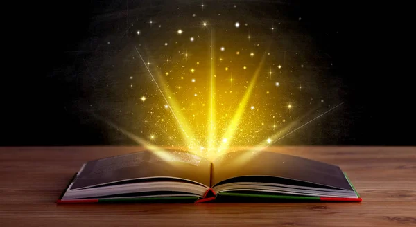 Yellow lights over book — Stock Photo, Image