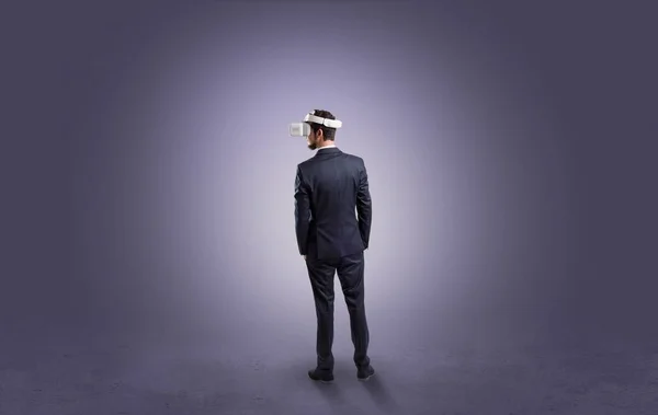 Businessman in an empty room with vr glasses — Stock Photo, Image