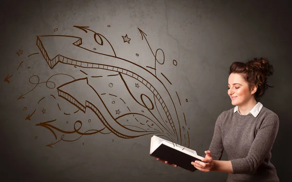 Young lady holding book with arrows — Stock Photo, Image