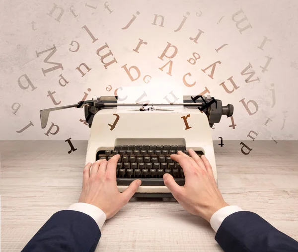 First person perspective elegant hand typing with flying letters concept — Stock Photo, Image