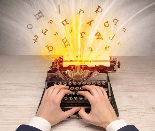 Letters exploding from a vintage typewriter — Stock Photo, Image