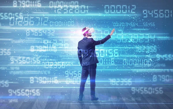Businessman with variable numbers around — Stock Photo, Image