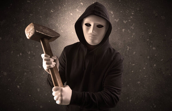 Armed villain in an empty dark room