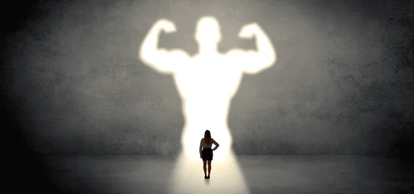 Woman standing in front of a strong hero vision — Stock Photo, Image