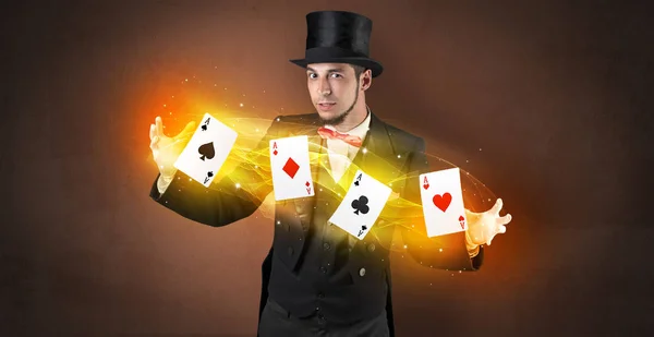 Illusionist making trick with magical play cards — Stock Photo, Image