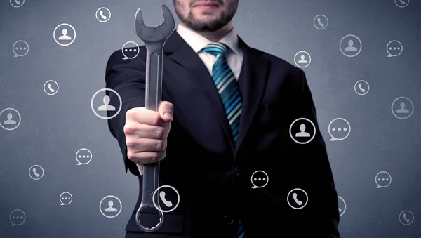 Handsome man standing with tool on his hand — Stock Photo, Image