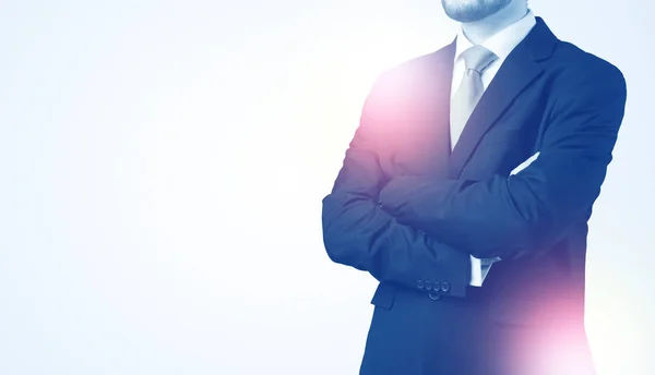 Young businessman standing and thinking — Stock Photo, Image