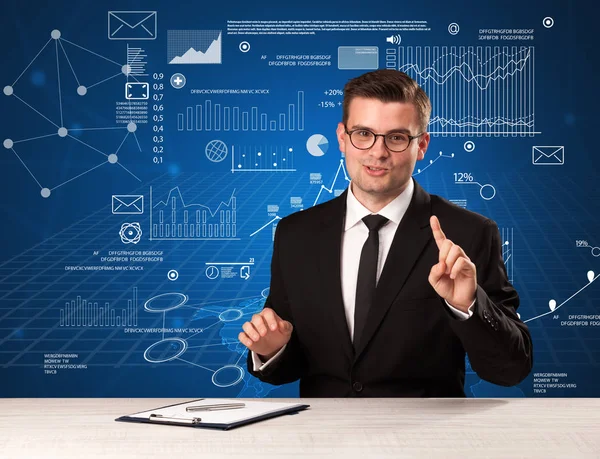 Businessman sitting at a desk — Stock Photo, Image