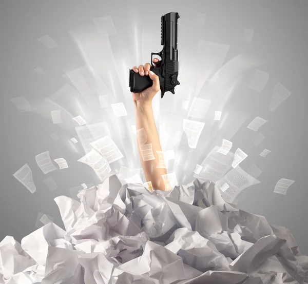 Hand coming out from paper pile — Stock Photo, Image