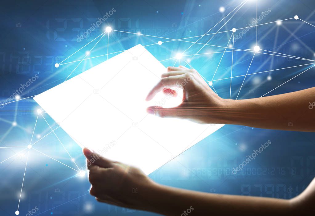 Hands touching a glass-like tablet 