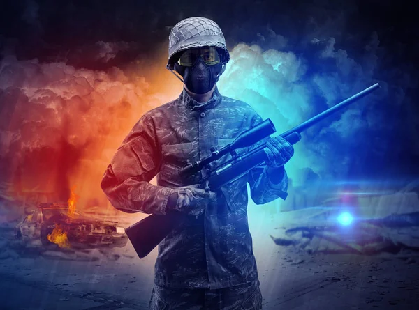 Armed soldier standing in the middle of dust storm — Stock Photo, Image