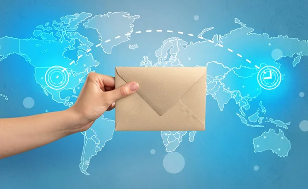 Hand holding envelope with global concept — Stock Photo, Image