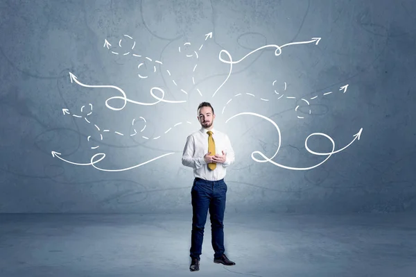 Businessman standing with winding arrows around — Stock Photo, Image