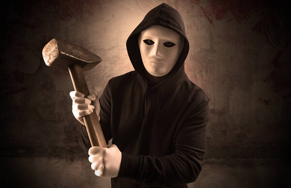 Armed assassin in an empty bloody room concept