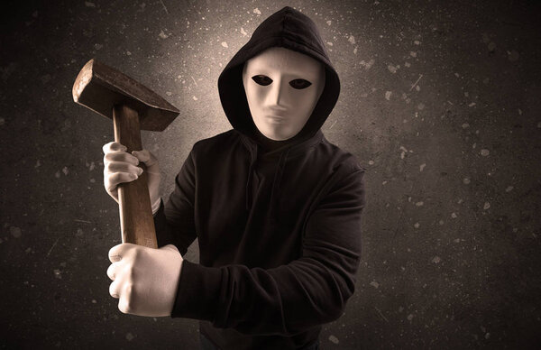 Armed villain in an empty dark room