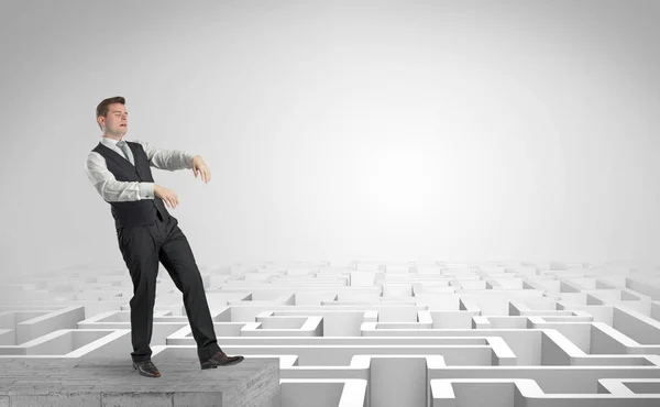 Sleepy businessman on the top of a labyrinth — Stock Photo, Image