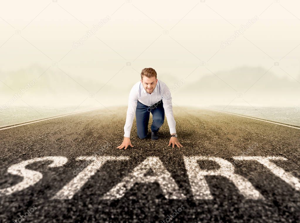 Businessman at start line