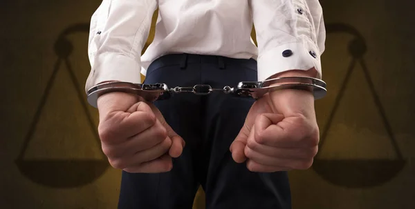 Arrested man with balance on the background — Stock Photo, Image